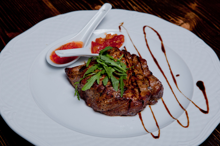 Grilled pork neckPork steak on a plateの写真素材