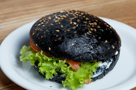 Hamburger black with salmon Hamburger black with salmon on a plateHamburger blackの写真素材