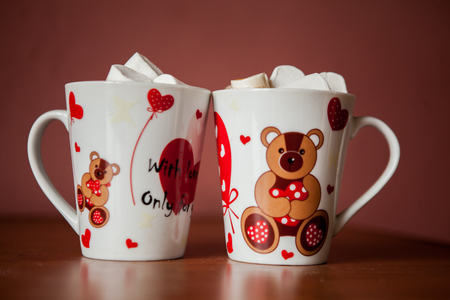 Hot chocolate with white marshmallows in hearts and teddy bears on Valentines Dayの写真素材