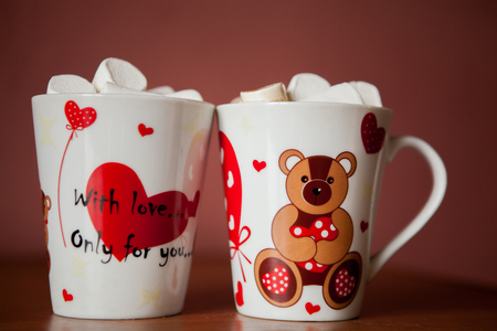Hot chocolate with white marshmallows in hearts and teddy bears on Valentines Dayの写真素材