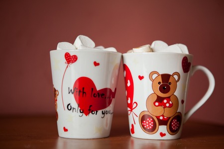 Hot chocolate with white marshmallows in hearts and teddy bears on Valentines Dayの写真素材