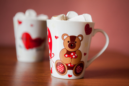 Hot chocolate with white marshmallows in hearts and teddy bears on Valentines Dayの写真素材