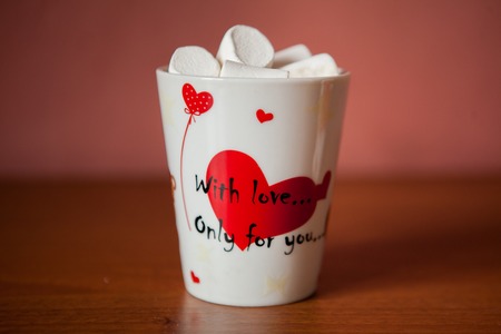Hot chocolate with white marshmallows in hearts and teddy bears on Valentines Dayの写真素材