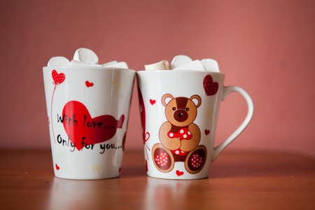 Hot chocolate with white marshmallows in hearts and teddy bears on Valentines Dayの写真素材
