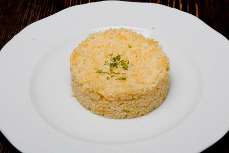 Risotto of wheat on a white plate.の写真素材