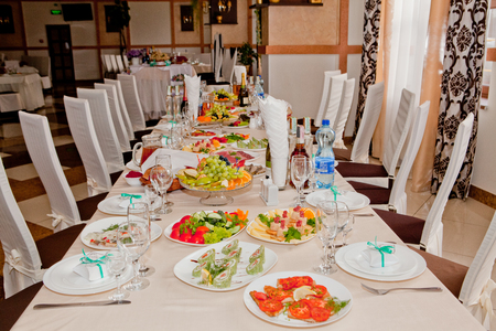 Festive table with gourmet food is set in a cafe or restaurant.の写真素材