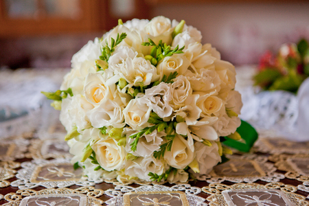 Wedding bouquet of white roses on a tablecloth. Bouquets for the brideの写真素材