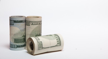 dollars on a white background, a stack of a hundred dollarsの写真素材