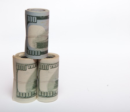 dollars on a white background, a stack of a hundred dollarsの写真素材