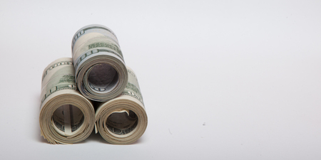 dollars on a white background, a stack of a hundred dollarsの写真素材