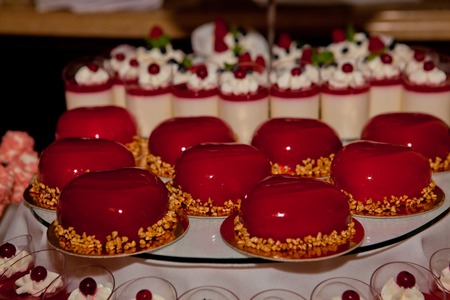 Trendy musk cake, decorated with red mirror glaze. Concept of St. Valentine.の写真素材
