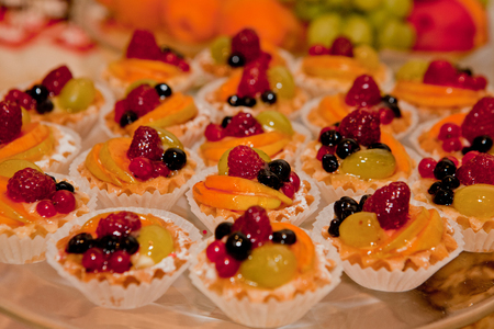 cakes with cream and fruits, background with cakesの写真素材