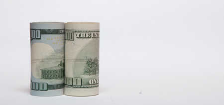 A roll of money, highlighted on a white background, a place for the text.の写真素材