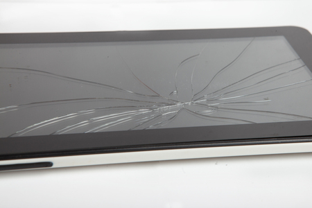 black broken tablet on white background, broken e-book screenの写真素材