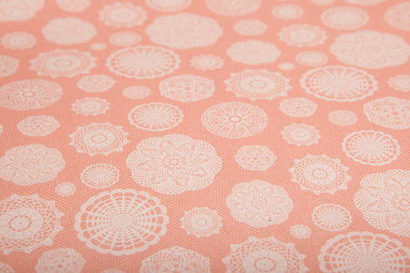 peach background with snowflakes cut out of paper, scrapbooking paper.の写真素材