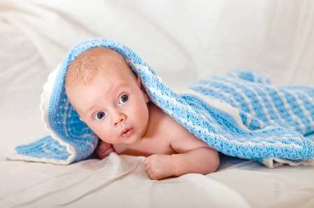 Baby, Two Month Old. Naked two-month-old baby is covered with a blue veilの写真素材