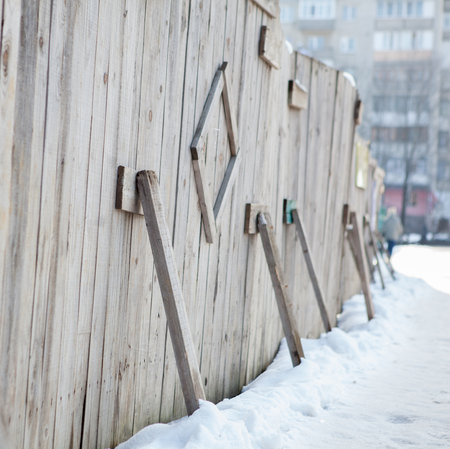 Temporary wooden fence around the building.Temporary wooden fenceの写真素材