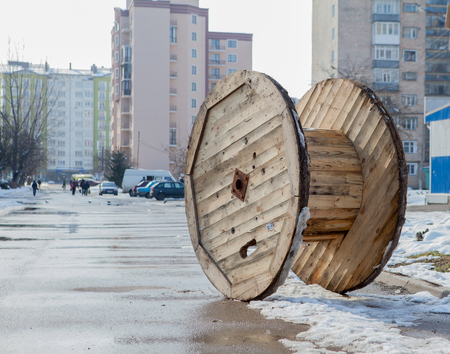 The abandoned wooden cable reel for the city.の写真素材