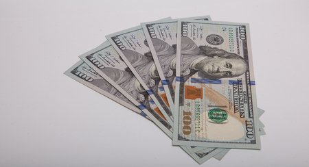 one hundred dollars of banknotes isolated on a white background.の写真素材