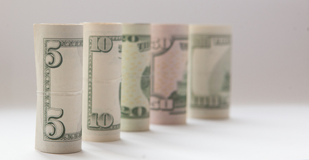 A roll of money, highlighted on a white background, a place for the text.の写真素材