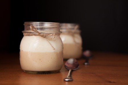 Delicious Dessert in a glass jar on a black background.の写真素材