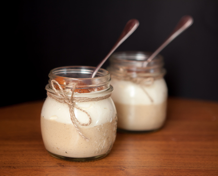 Delicious Dessert in a glass jar on a black backgroundの写真素材