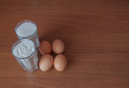 Composition with some products for cooking byskvyt or cake on wooden backgroundの写真素材