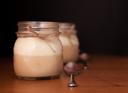 Delicious Dessert in a glass jar on a black background.の写真素材
