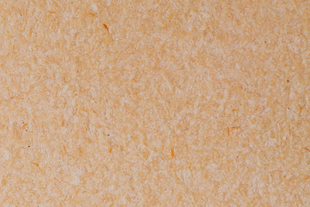 Wall Cement Backgrounds and Textures. Color Coral Textured Stone. Abstract Surface, Porous and Textured Plaster Wall. Salmon-colored Wall flat lay. peach background cement surface.の写真素材