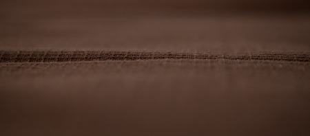 Brown fabric texture for background,focus in the centerの写真素材