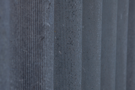 The wall of the house is covered with slate. Facing wall and roofing building material. Slate. Background.の写真素材