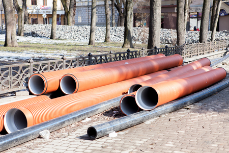 Corrugated water pipes of large diameter prepared for laying.の写真素材