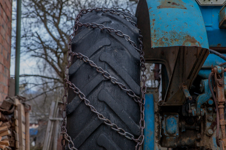 tractor equipped with snow chains. Winter concept.の写真素材