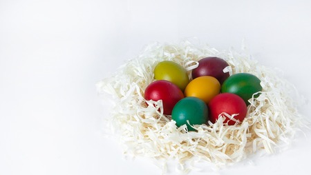 Colored easter eggs isolated on white background, place for text.の写真素材