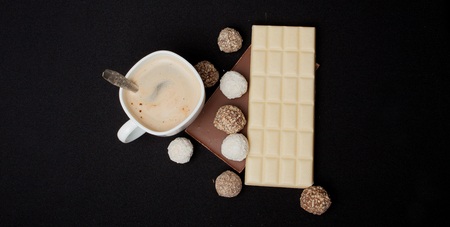 Cofe, Stack of Black and White Chocolate isolated on black background, Top view with copyspace for your text.の写真素材