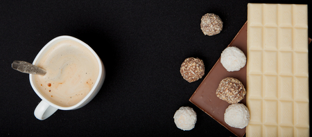 Cofe, Stack of Black and White Chocolate isolated on black background, Top view with copyspace for your text.の写真素材