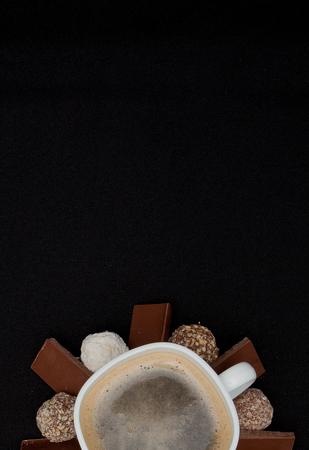 Cofe, Stack of Black and White Chocolate isolated on black background, place for text.の写真素材