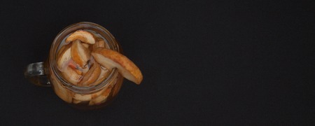 compote of dried fruits with dried fruit on a black background. Top view with copyspace for your text.の写真素材
