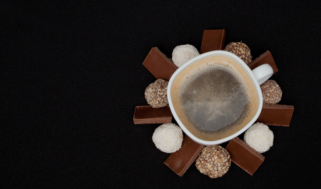 Cofe, Stack of Black and White Chocolate isolated on black background, place for text.の写真素材