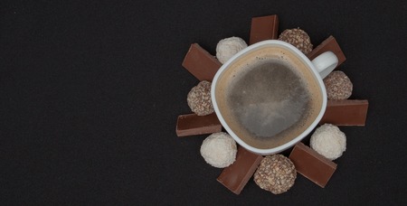 Cofe, Stack of Black and White Chocolate isolated on black background, place for text.の写真素材