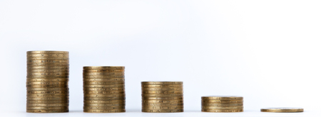 Growing coins stacks on white background. Financial growth, saving money, business finance wealth and success concept.の写真素材
