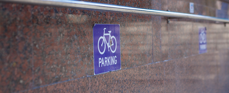 sign of parking bicycle on a granite background.の写真素材
