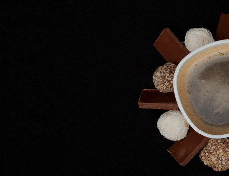 Cofe, Stack of Black and White Chocolate isolated on black background, place for text.の写真素材