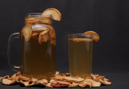 compote of dried fruits with dried fruit on a black background.