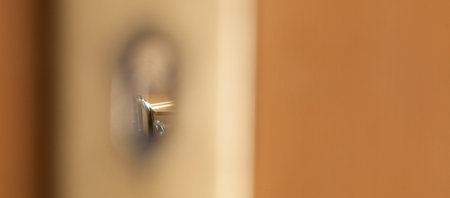the look of the school desk through the opening of the door lock.