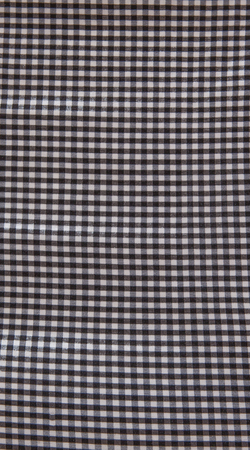 Grey and white checkered fabric texture background.の写真素材