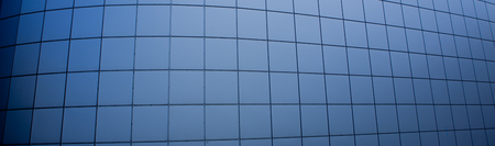 Clouds Reflected in Windows of Modern Office Building.の写真素材