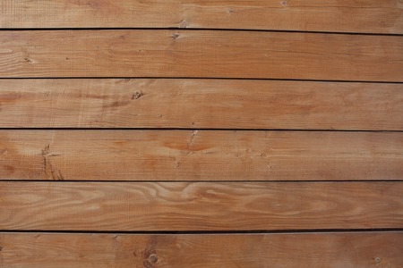 The varnished boards. The wooden textured background. The vertical plank.の写真素材