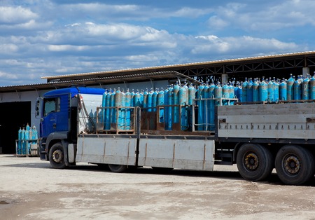 Truck for transportation of gas cylinders. The car delivers gas to the shops, restaurants and residents of the city. Truck before unloading gas cylinders.の写真素材