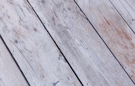 Background texture of old white painted wooden lining boards wall.の写真素材